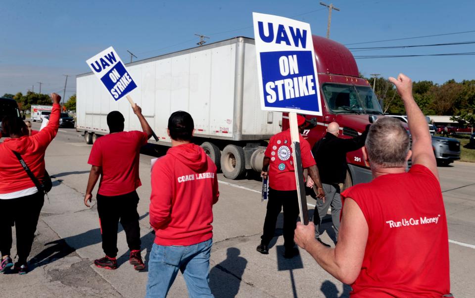 Striking Ford Motor Company employees represented by the UAW and Local 900 walk on the sidewalk across the entrance to gate 9 at the Michigan Assembly in Wayne blocking independent truck drivers from getting into the plant on Friday, Sept. 15, 2023.
A member of the Teamsters told the truckers that the strikers would be here all day walking here and that it would be impossible for them to pull in for their deliveries or pickups.